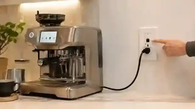 Breville Oracle Touch connected to a wall outlet for breaker troubleshooting